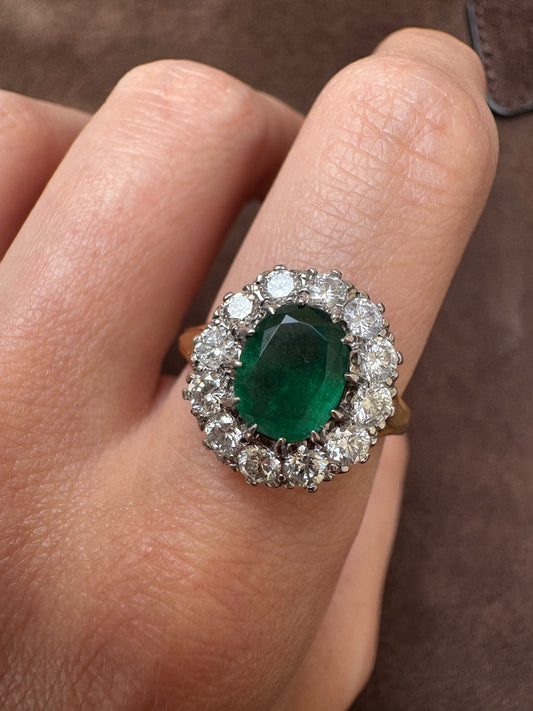 Oval Emerald and Diamond Halo ring